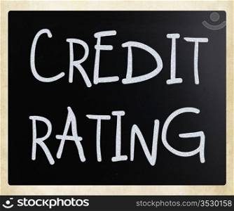 ""Credit rating" handwritten with white chalk on a blackboard."
