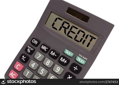 credit written on display of an old calculator on white background in perspective