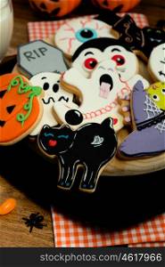 Creepy Halloween cookies on a black plate