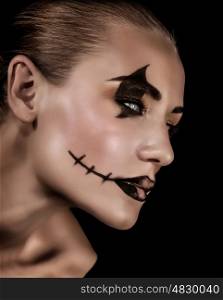 Creepy vampire portrait isolated on black background, fashionable makeup for Halloween part, horror and mystery concept