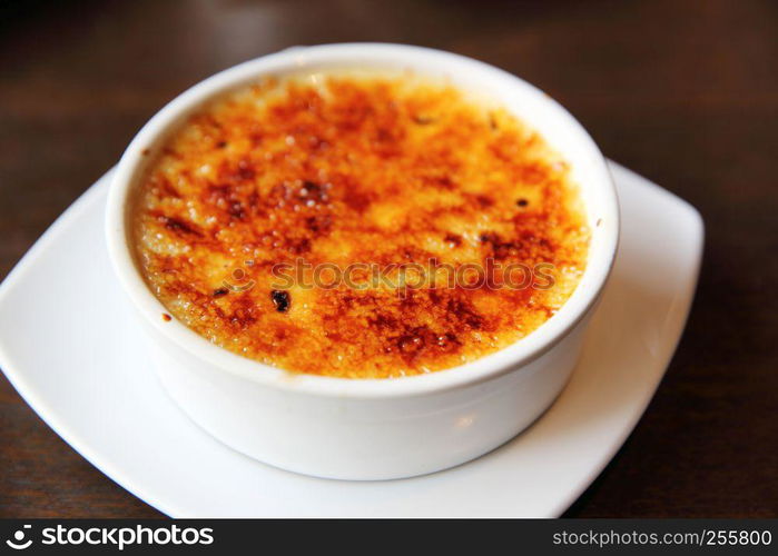 Creme Brulee on wood background