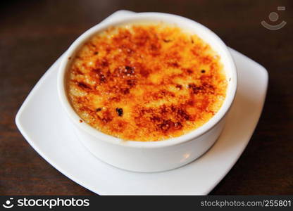 Creme Brulee on wood background