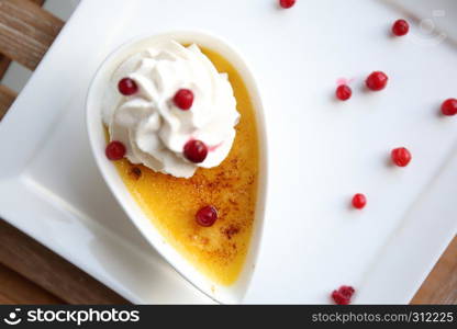 Creme brulee. Traditional French vanilla cream dessert with fruit
