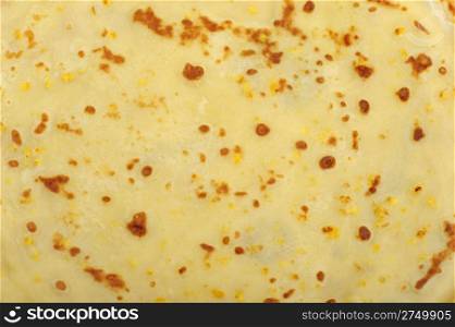 Crepe background. A detailed photo fried thin pancake.