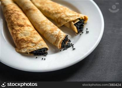 Crepes with black caviar