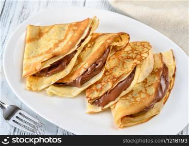 Crepes with chocolate cream close up