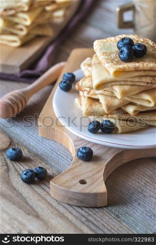 Crepes with fresh blueberries and honey