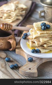 Crepes with fresh blueberries and honey