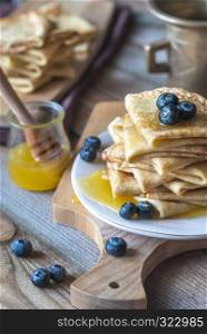 Crepes with fresh blueberries and honey
