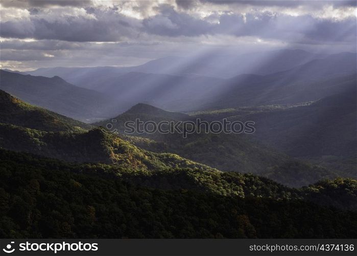 Crepuscular light rays shining across the North Fork Valley in West Virginia, illuminating some of the early Autumn color down below.