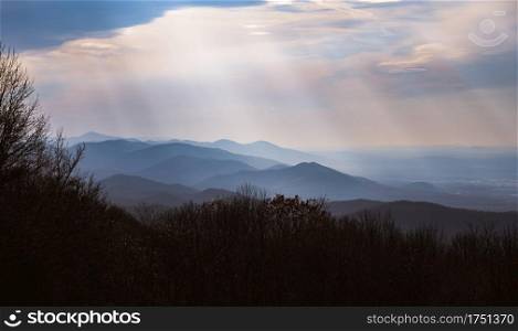 Crepuscular rays shining down on the Blue Ridge Mountains of Shenandoah National Park in Virginia.