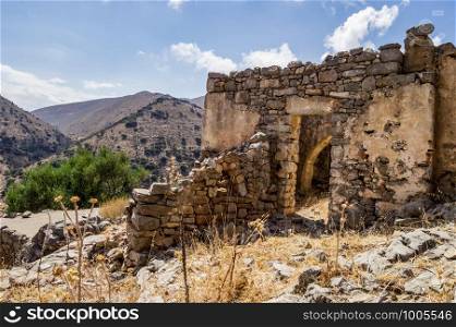 Cretrate house in ruin facing the mountains on the island of Crete in Greece