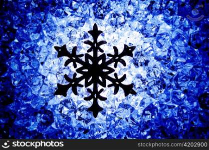 Crhistmas snowflake star symbol over blue ice background