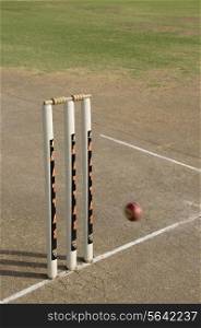 Cricket ball approaching stumps