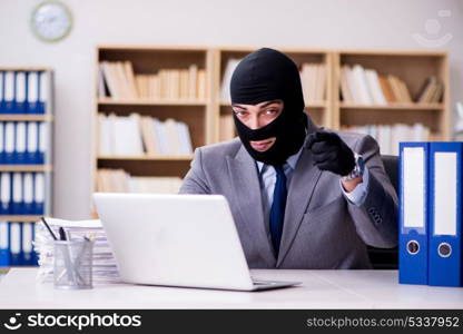 Criminal businessman with balaclava in office