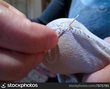 Crisis, mending socks