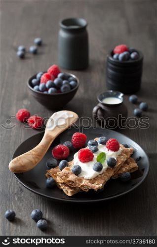 crisp bread with creme fraiche and berries