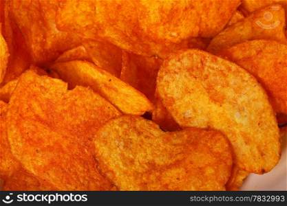 Crisps. Close up potato paprika chips as background