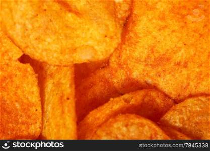 Crisps. Close up potato paprika chips as background
