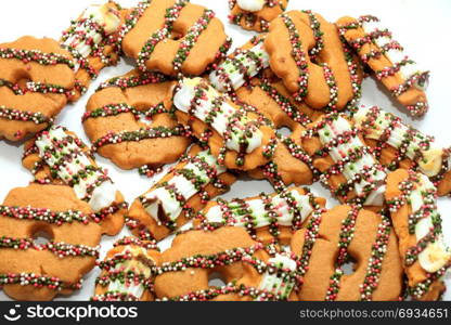 Crispy Christmas Cookies decorated with chocolate and sprinkles