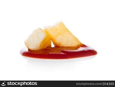 Crispy french fries potato macro with ketchup on white background