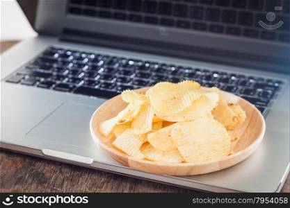 Crispy potato chips on wotk station, stock photo