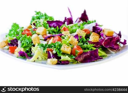 Crispy salad leaves with diced bread and tomatoes