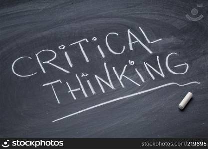 Critical thinking - white chalk handwriting on a blackboard