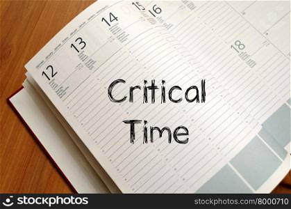 Critical time text concept write on notebook with pen