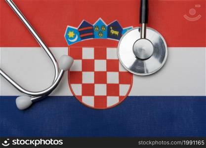 Croatia flag and stethoscope. The concept of medicine. Stethoscope on the flag in the background.. Croatia flag and stethoscope. The concept of medicine.