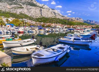 Croatia summer holidays - Famous Adriatic coast - Makarska riviera in Dalmatia. Charming marine with fishing boats. . Makarska town. Dalmatia, Croatia