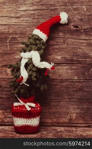 Crochet Christmas tree with scaf and Santa hat, cold winter style