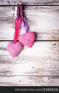 Crochet valentine hearts handing on the rope. Valentine&rsquo;s day greeting card. Love concept