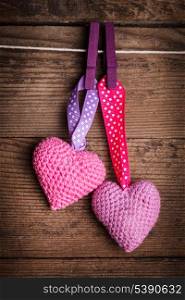 Crochet valentine hearts handing on the rope. Valentine&rsquo;s day greeting card. Love concept