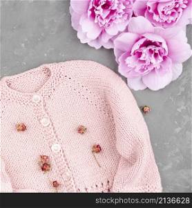 crocheted pink jacket with flowers