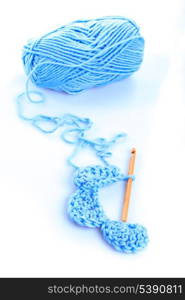 Crocheting pattern and a ball of yarn isolated on white