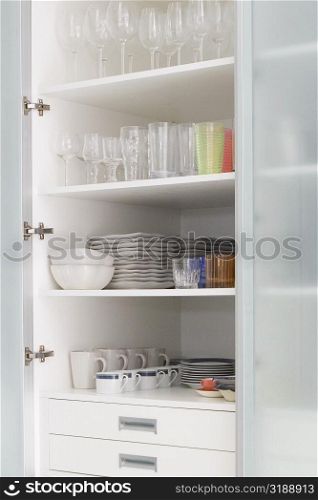 Crockery in a kitchen shelf