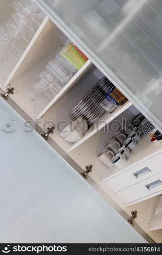 Crockery in a kitchen shelf