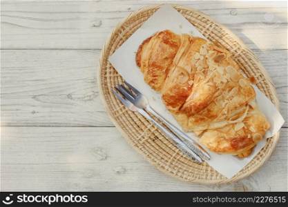 Croissant delicious tasty homemade french bread on wood background.