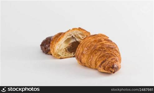 croissant with chocolate filling isolated on white background. french croissant on white