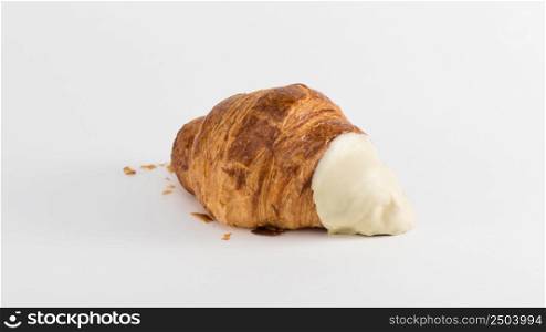 croissant with cream filling on a white background. french croissant on white