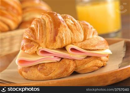 Croissant with ham and cheese (Selective Focus, Focus on the ham and cheese slices)