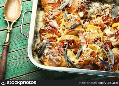 Croissants baked with cheese, bacon, boiled pork and sage.. Croissant with baked ham baked with herbs.