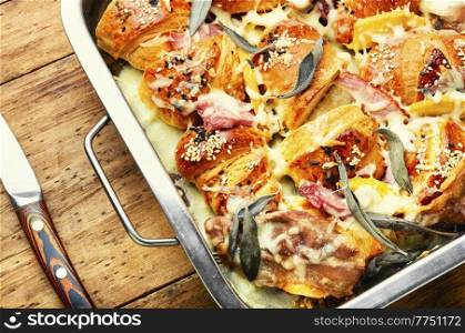 Croissants baked with mozzarella cheese, bacon, boiled pork and sage.. Croissants baked with cheese and meat.
