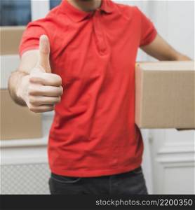 crop courier gesturing thumb up