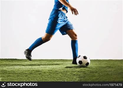 crop football player shooting ball. High resolution photo. crop football player shooting ball. High quality photo