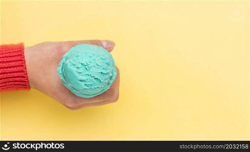 crop hand holding ice cream