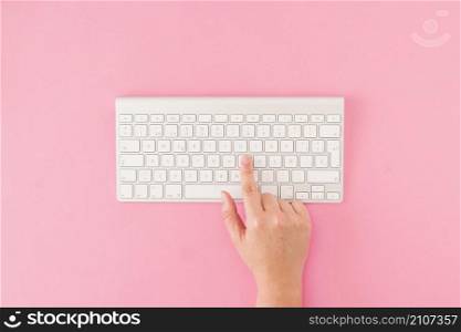 crop hand pushing buttons keyboard
