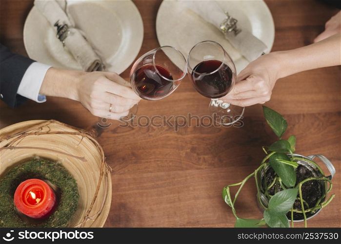 crop loving couple toasting with wine