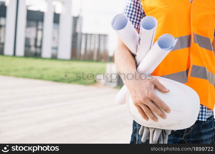 crop man with blueprints helmet. Resolution and high quality beautiful photo. crop man with blueprints helmet. High quality beautiful photo concept